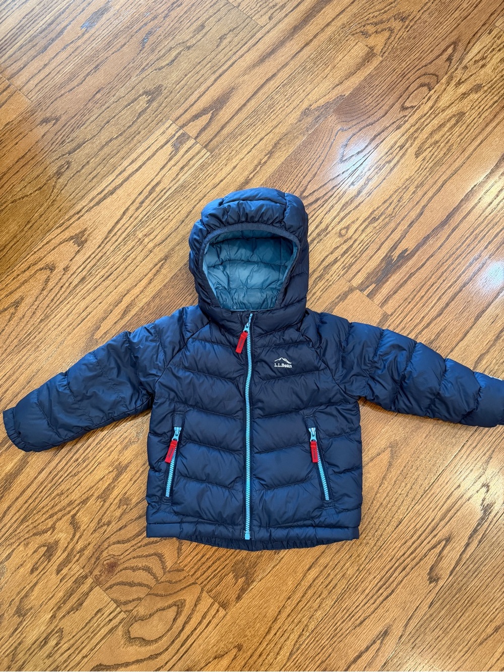Very good used L.L. Bean Navy Kids Hooded Puffer Jacket with Light Blue Trim